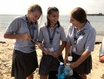 Honors biology students from Fontbonne Hall Academy collecting water samples